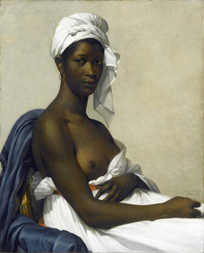 A young black woman with dark brown eyes is seated in a side profile, with her head turned to look out directly at the viewer with a serious expression. She wears a white cloth wrapped around her head and a loose white dress. The the arm facing the viewer has been taken out of its sleeve to rest on the woman's lap and the dress pulled down to reveal her bare breast.