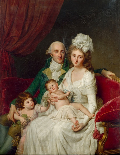 A man, a woman, and two very young children, all with light skin and hair, are seated together on a red velvet couch. The man wears a green coat and looks at the woman seated next to him, with one arm around the shoulder of a young child standing near his knee. The woman is wearing a white dress and a large white bow in her hair, and she is holding an infant in her lap as she looks out at the viewer.
