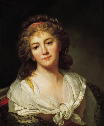 A woman with light skin and dark blonde or light brown hair is shown from the chest up. She wears a white shawl tied around her shoulders, and looks slightly away from the viewer.