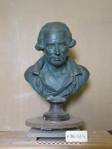 A greenish-blue bust of the head and shoulders of a man with a loose, open collar, receding hairline, and hair that curls just above his ears.