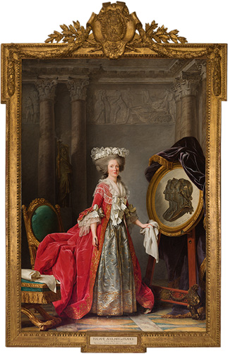 A light-skinned woman with rosy cheeks and a large, elaborate updo of gray hair stands in front of an easel with an artwork on it. She is wearing a red dress with a white ruffled front and skirt, a white cap over the top of her hair, and holds a white cloth in one hand. The image on teh easel shows the faces of three men, overlapping and in profile. The entire painting is framed in an elaborate gold frame with a crest and laurels at the top.