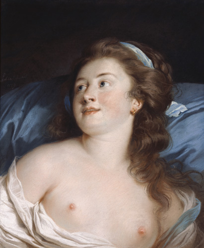 A young woman is depicted from the chest up, reclining against a blue background. She has very light skin, dark brown wavy hair with a blue ribbon tied in it, and blue eyes. She is wearing a white dress or shift, which has been pulled down to reveal her shoulders and both breasts. Her head is turned slightly away from the viewer, and she has a slight smile on her face.