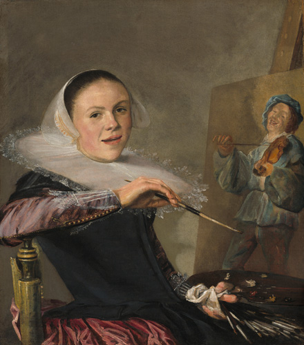 A woman with light skin and dark hair is seated before an easel, turned to look out at the viewer while leaning back on her chair with one elbow and the hand with her paint palette resting in her lap. She has a dark dress with a large, disc-shaped collar with lace trim around the edge, and she is holding a paintbrush loosely in her hand. On the easel before her, an incomplete painting of a young man dressed in blue with a violin is visible.