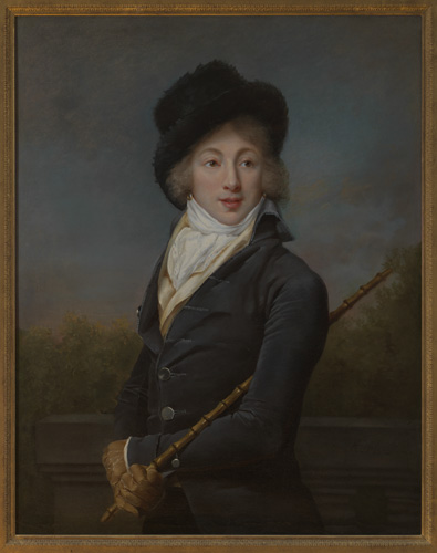 A young person with light skin and pale blonde hair is shown from the waist up. They wear a dark blue coat, brown gloves, a high white collar, and a black hat that may be of fur. Their arms are crossed at the wrist and in one hand the end of a cane is grasped and held up under the opposite armpit.