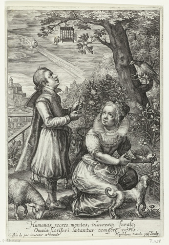 A black and white image shows two figures, one man and one woman, outdoors together. The man looks upward toward a tree with a bird and a small cage in it, while the woman kneels and grips a plant by the stalk. Near their feet are a small dog and a grazing sheep.