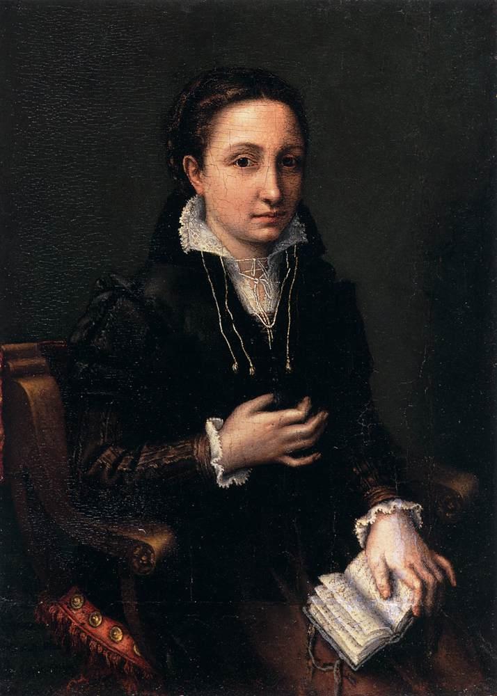 A portrait of a young man seated with a book in her lap. She is holding her right hand at her chest. She is dressed in sixteenth-century clothing, with a white collar around her face and her hair is pulled back, crowned with a braid.
