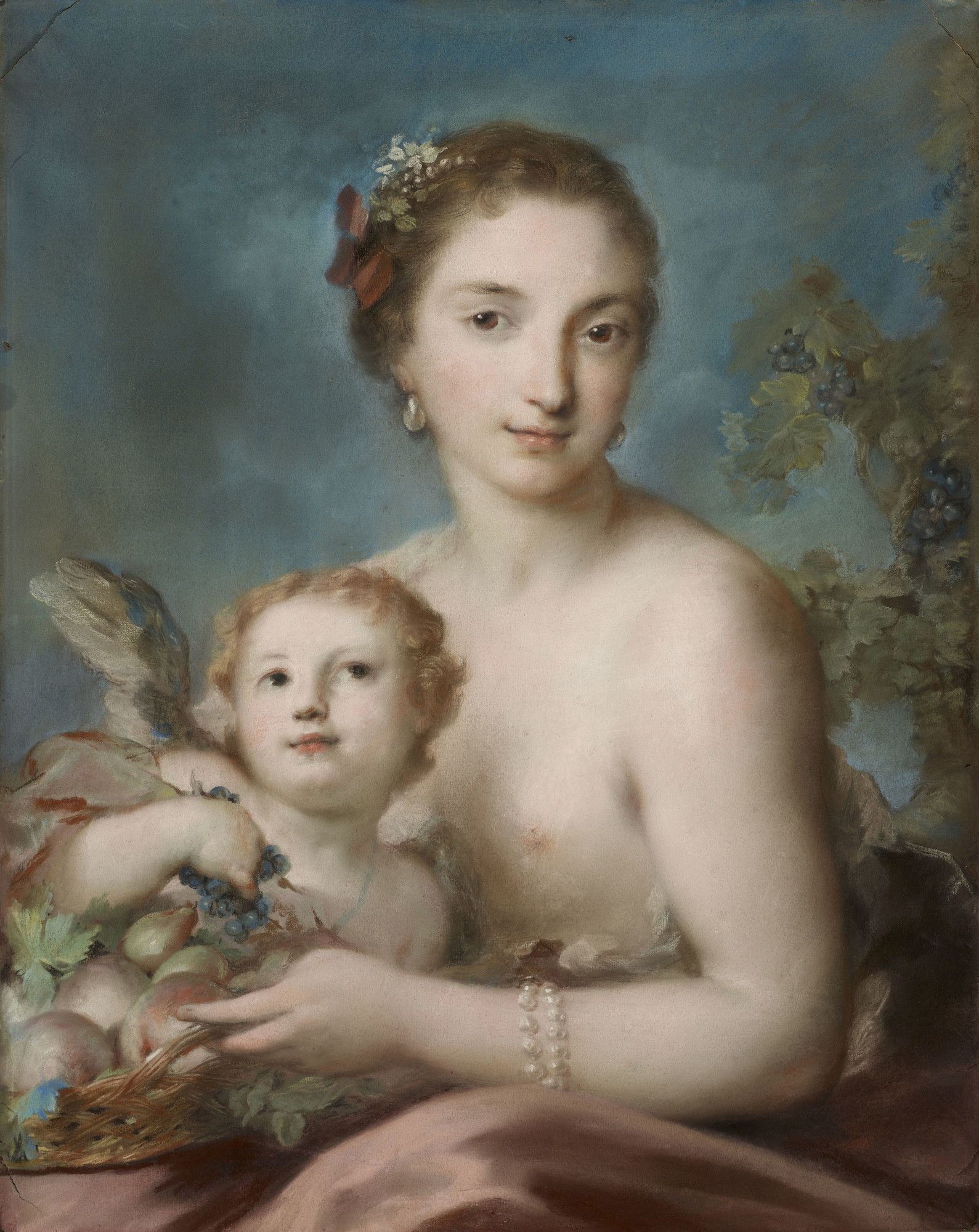A half-length portrait of the personification of autumn, who is pictured as a young woman with a bare chest and pink robes draped in her lap. A putto sits in her lap and looks up towards her holding grapes plucked from the basket of fruit the young woman is holding. 