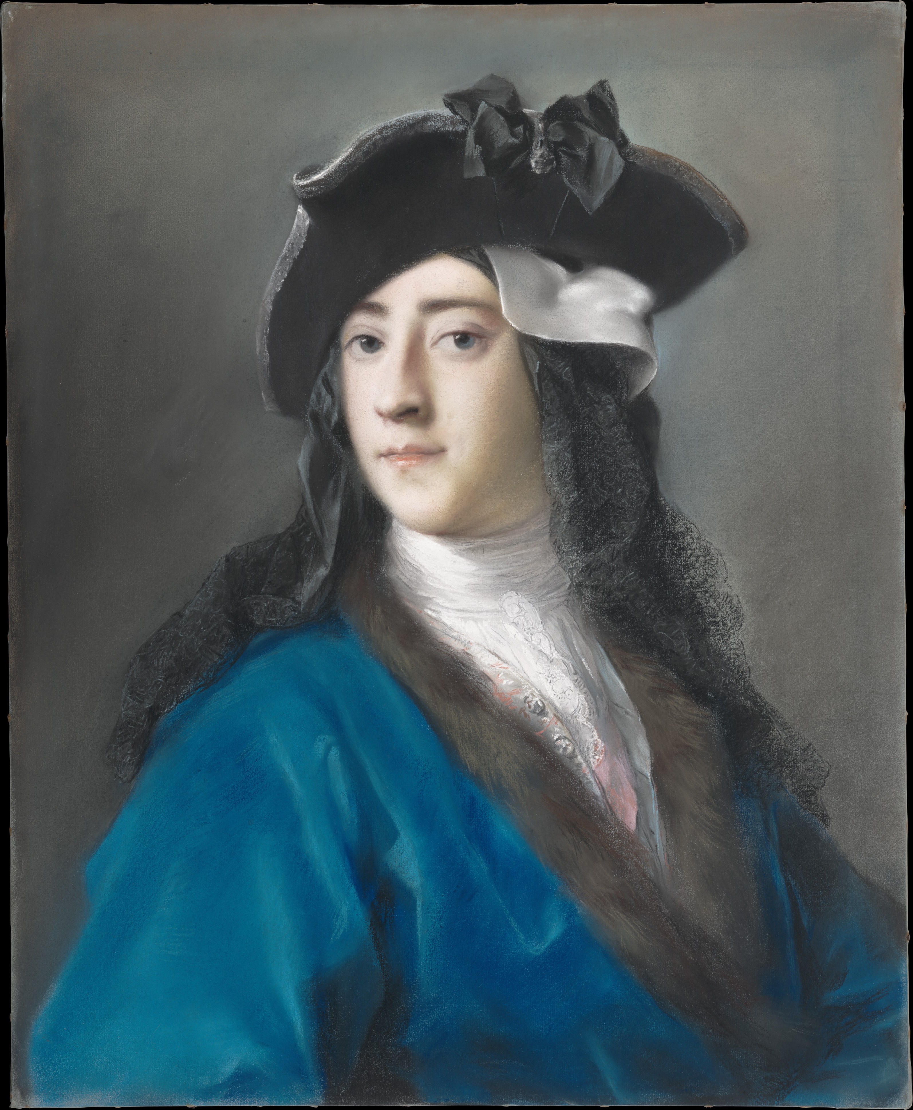 A half-length portrait of a man wearing a bright blue coat trimmed with fur and an elaborate black and white hat. He looks at the viewer with a slight smile.