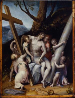 An image of Christ descending from the cross, being held by several figures. The setting is a landscape, with a tree directly behind the figure group. Christ’s body is pale, and the figures are closely grouped, looking at him. 