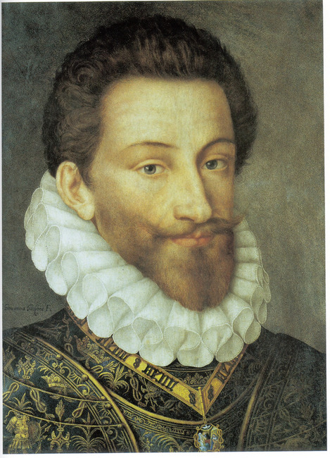 A bust-length portrait of a man wearing an elaborate gold and black costume with a large white ruff. He appears to be in his mid-thirties, with thick brown hair and a beard. His mustache is twirled at both ends. He looks out directly at the viewer with a neutral expression, his eyebrows slightly raised.