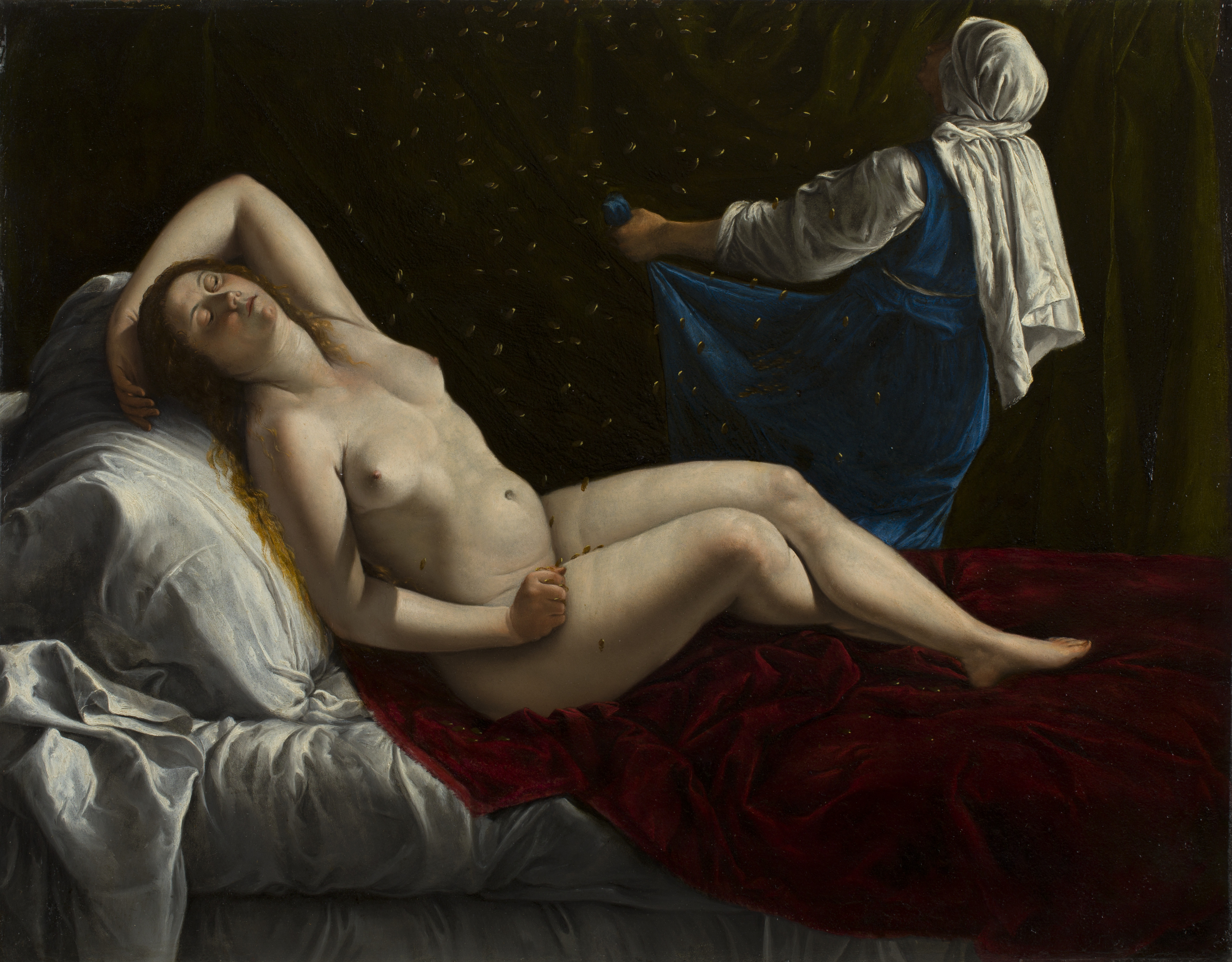 A nude woman reclines on a bed made with white sheets and a red velvet cover. She has one arm up behind her head and the other resting on her thigh, with her eyes closed. Behind her, a woman in a blue dress with a white chemise and head covering lifts up her skirt to catch gold coins that fall from above onto Danaë. 