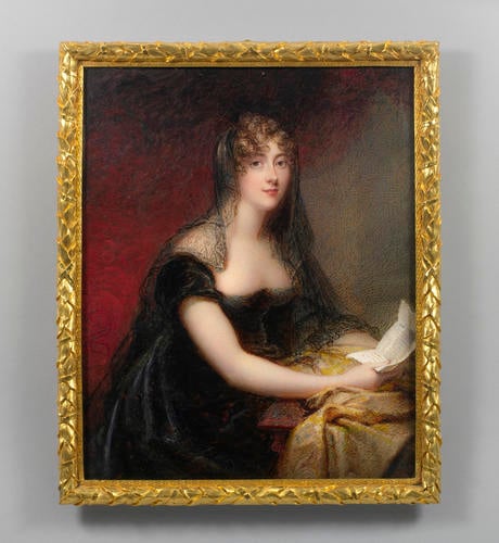 A half-length portrait miniature of a young woman in a black dress, wearing a sheer black veil covering the back of her hair and her shoulders. She is seated holding papers, and she looks up to meet the viewer’s gaze directly. The background is gray and red, and there is a gold cloth on the table where she rests her forearms. 