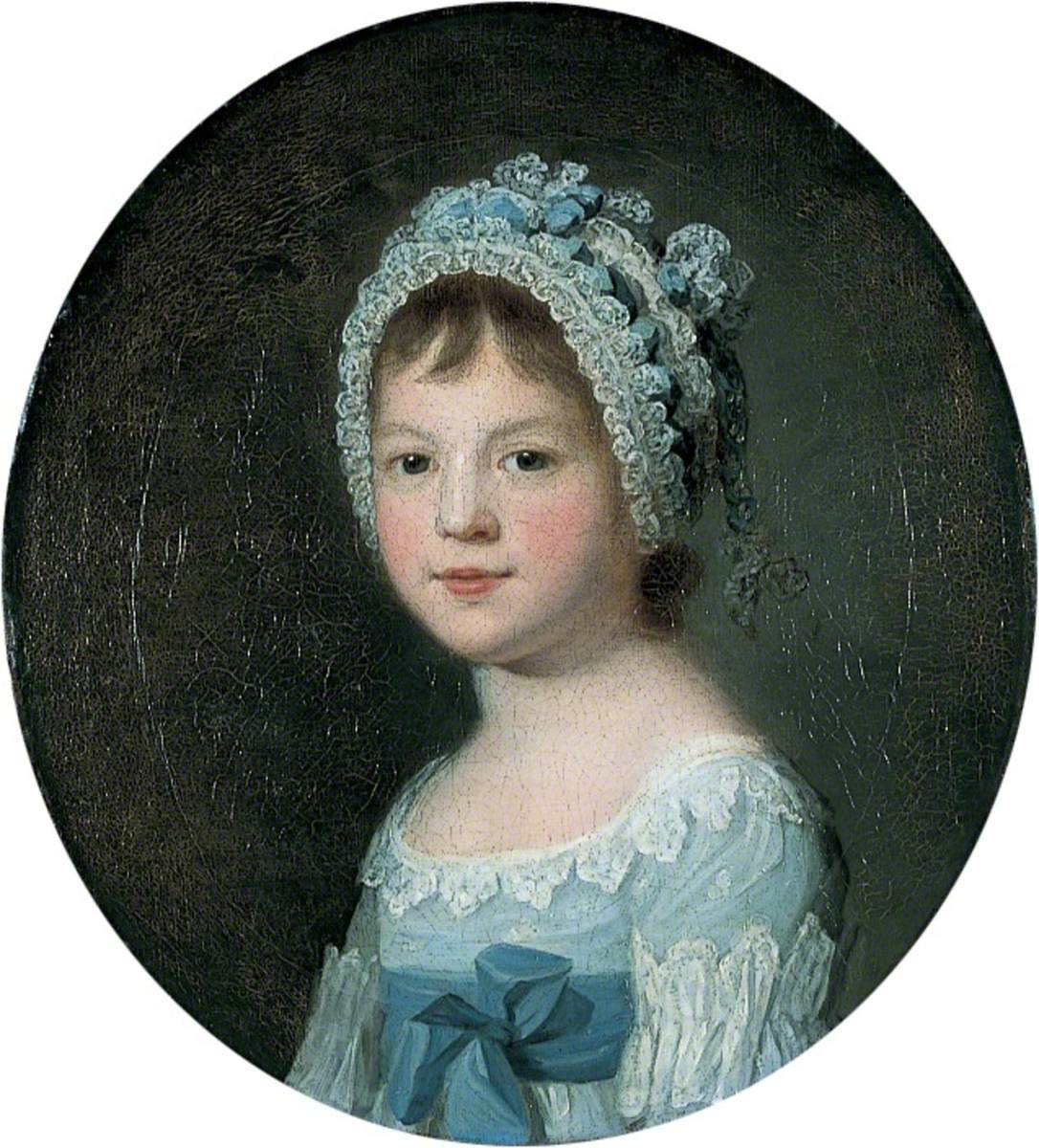 An oval, bust-length portrait of a young girl turned to the left but looks directly at the viewer. She wears a light blue dress embellished with white lace and a large blue bow. Her bonnet is made of lace and blue ribbon and covers most of her hair. The young girl has bangs and rosy cheeks; she has a sweet expression, with a slight smile. 