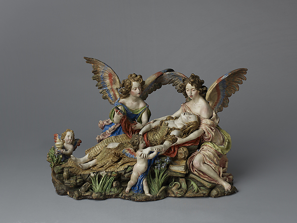 A polychrome terracotta sculpture of Mary Magdalene in ecstasy, being held by two angels. The angels are women with long brown hair and there are two putti included as part of the figural group. The sculpture also includes landscape elements, such as grass and flowers along the base.